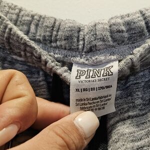 Pink gray,white and black with sequences the bottom that says pink